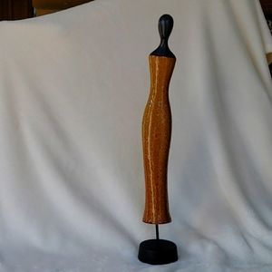 Figure of a woman on pedestal